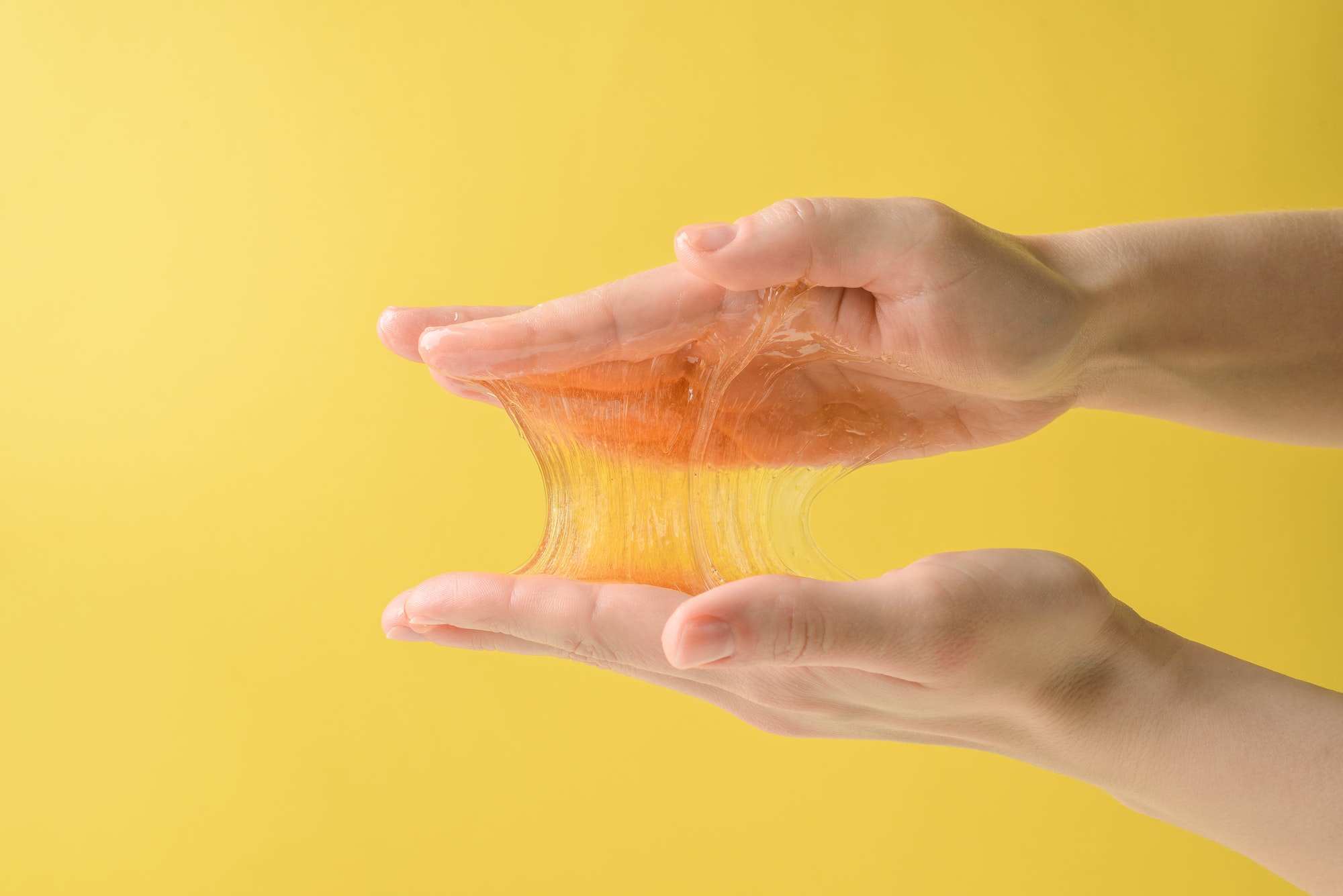 Hands with sticky sugar wax piece